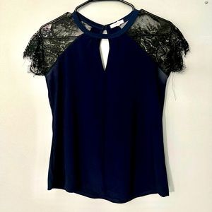 Navy blouse with lace shoulder accent